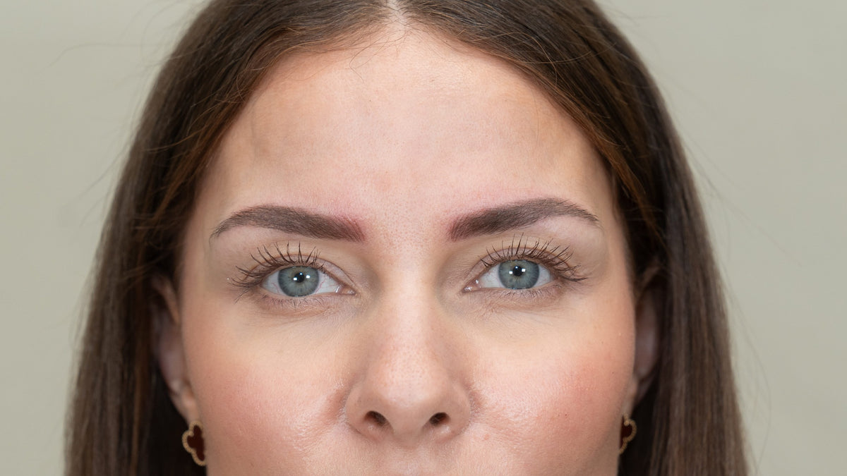 Close-up of powder brows on client’s face.