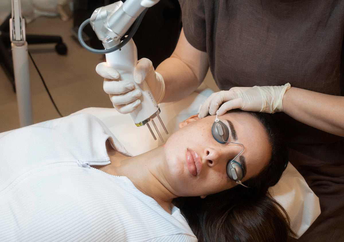 Woman receiving Pico Laser treatment in Dubai with a specialist at BROWZ, rejuvenating her skin for a brighter and smoother look.