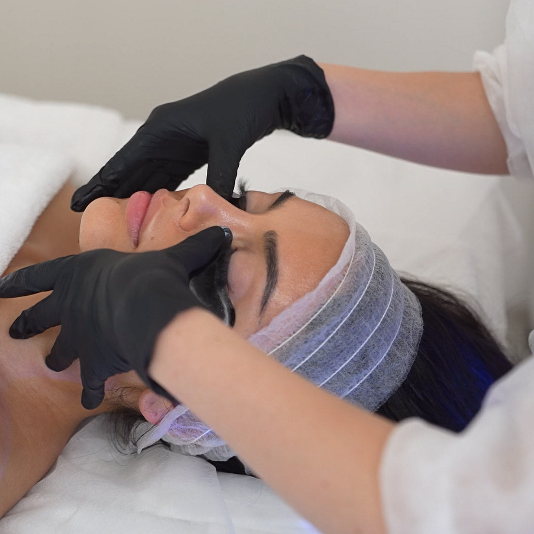 The HydraFacial device is being used around the delicate eye area to remove blackheads and unclog pores, offered at BROWZ in Dubai