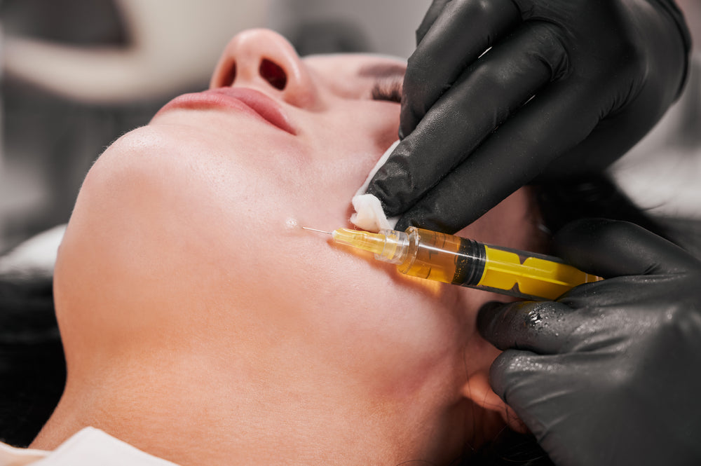 Close-up of client’s face while specialist carefully applies PRP treatment at BROWZ Dubai, ensuring precision and optimal results