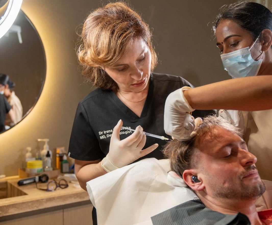 Client receiving Regenera Activa hair treatment from a specialist at BROWZ clinic in Dubai for natural hair restoration results.