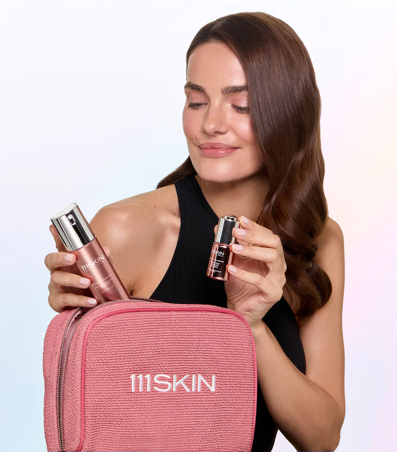 Woman holding 111SKIN Radiance Booster and Face Mist at BROWZ shop, showcased as a perfect Christmas gift ideas​ for skincare. 