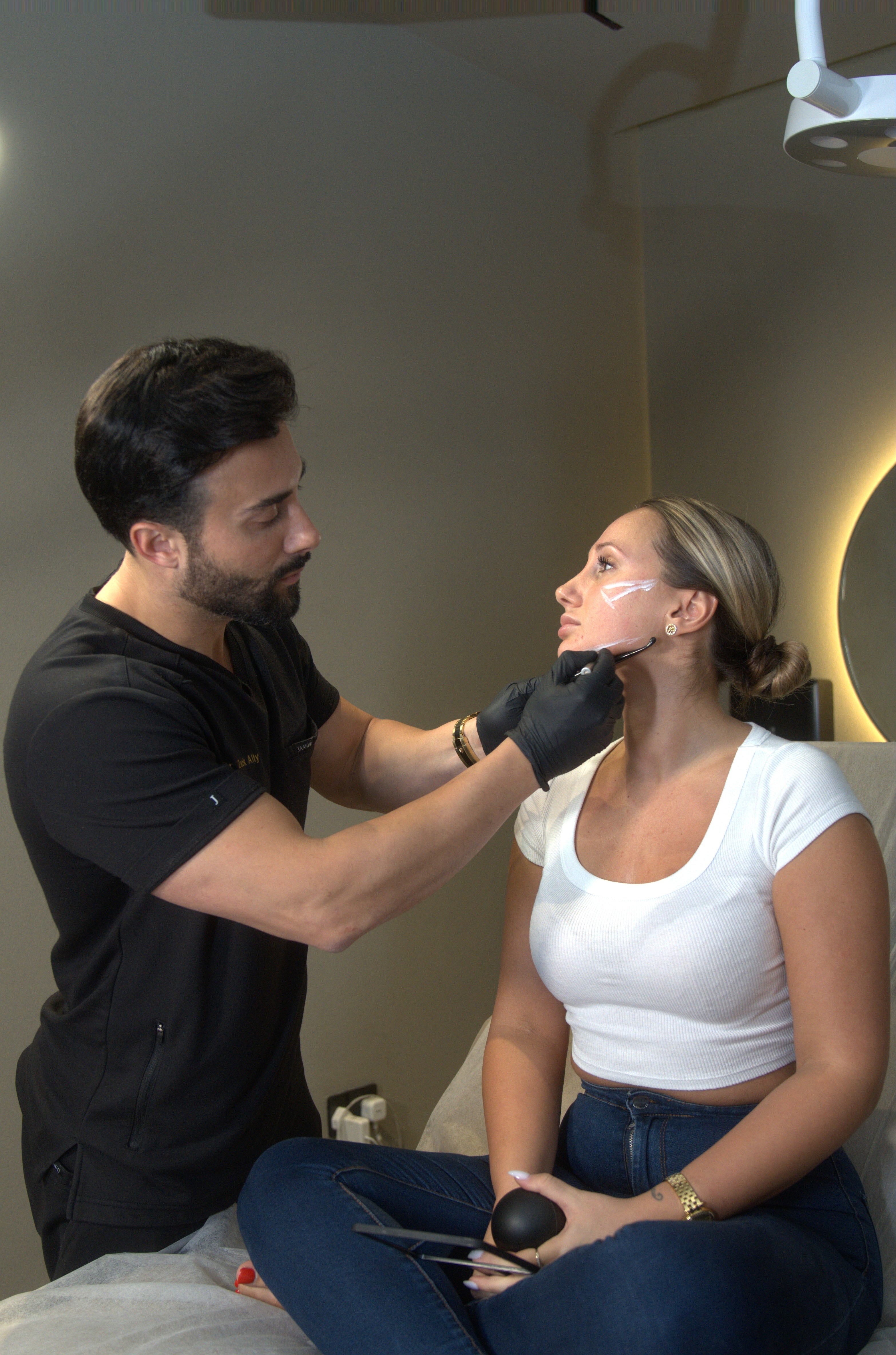 Dr. Zack marking face for non-surgical face contouring