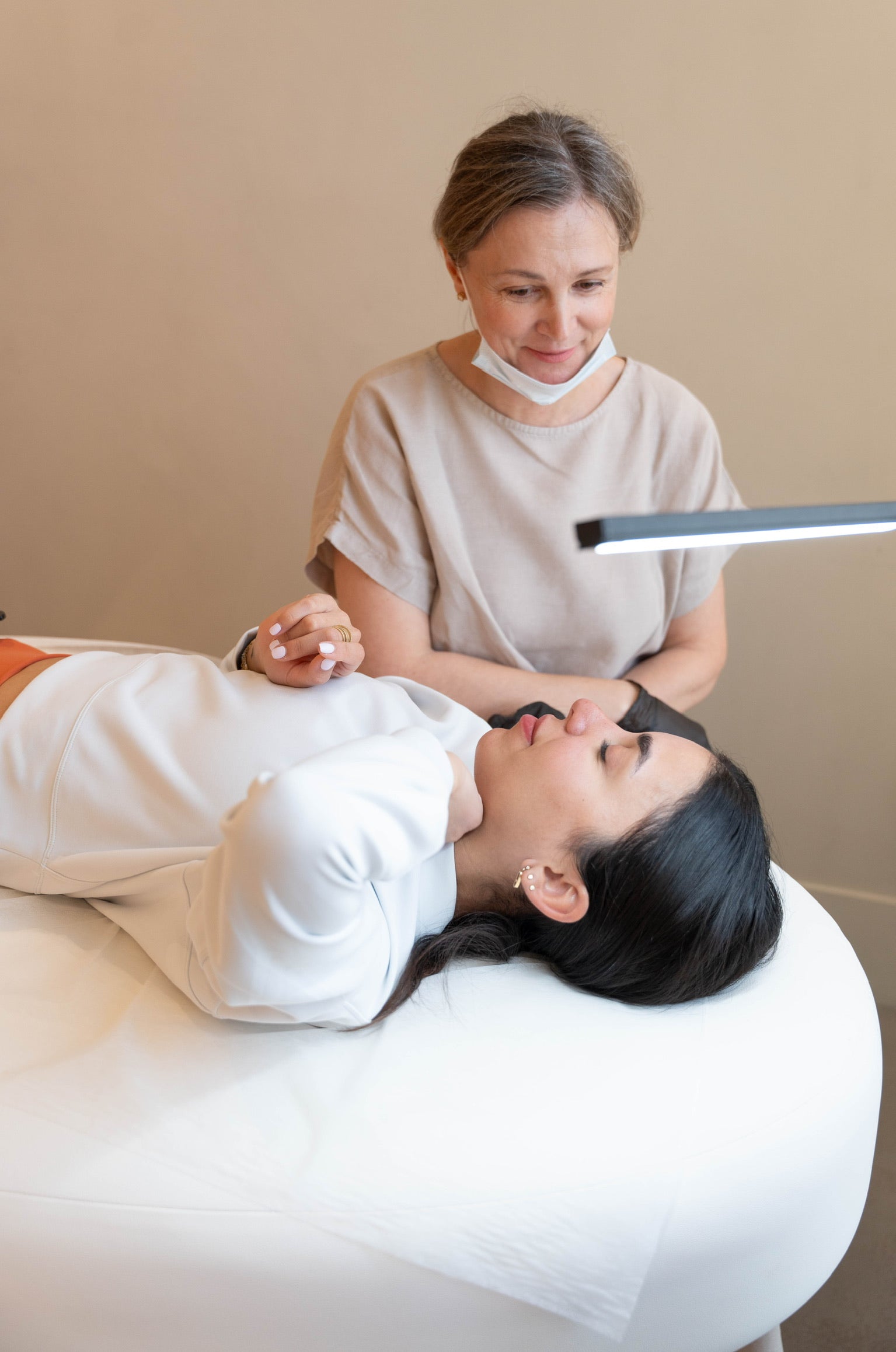 Consultation for Moxi Laser treatment at BROWZ, where a specialist assesses skin condition to create a laser resurfacing plan.