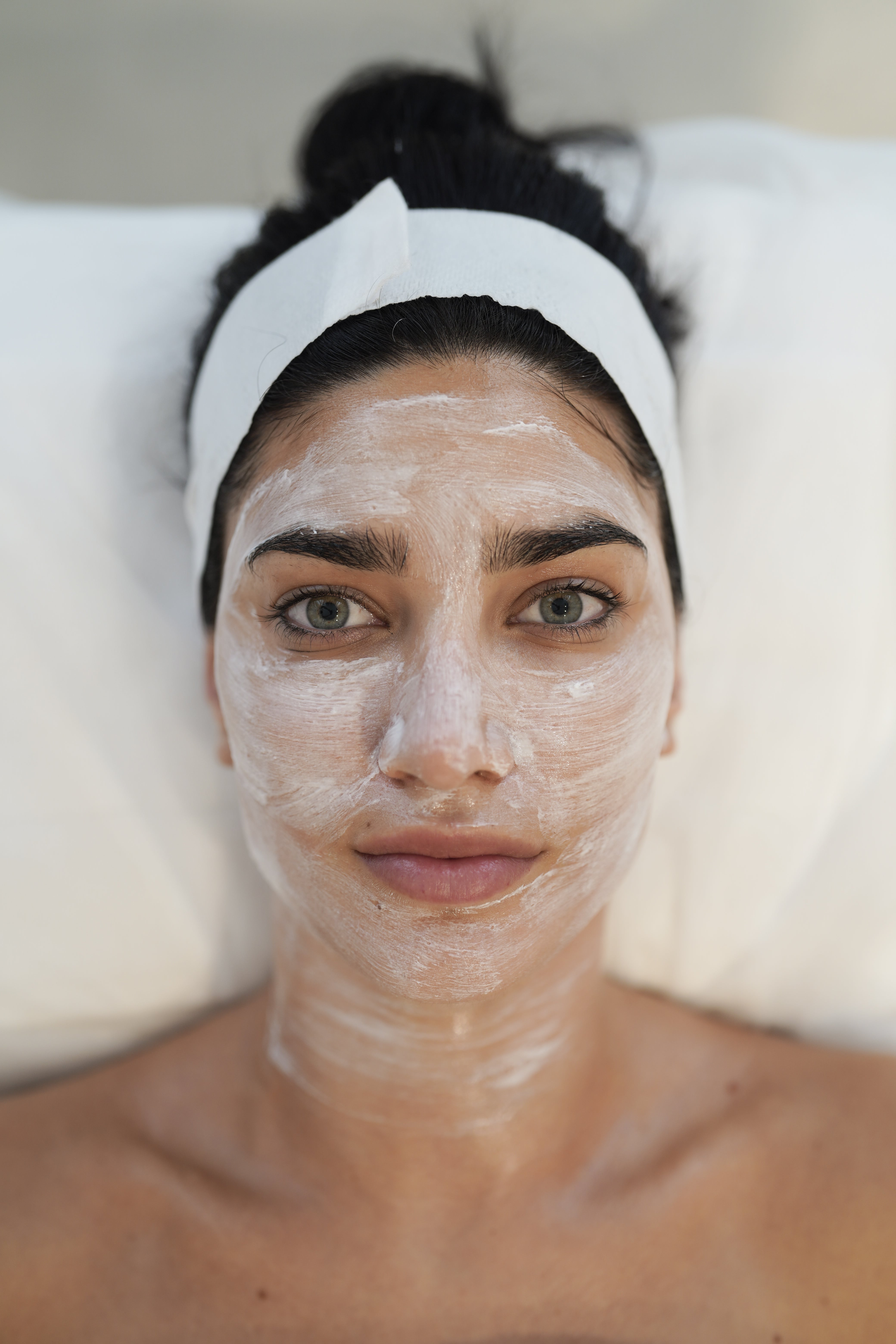 Preparing for Moxi Laser treatment and gently cleansing the skin to remove oils, sunscreen, and makeup for a clean surface