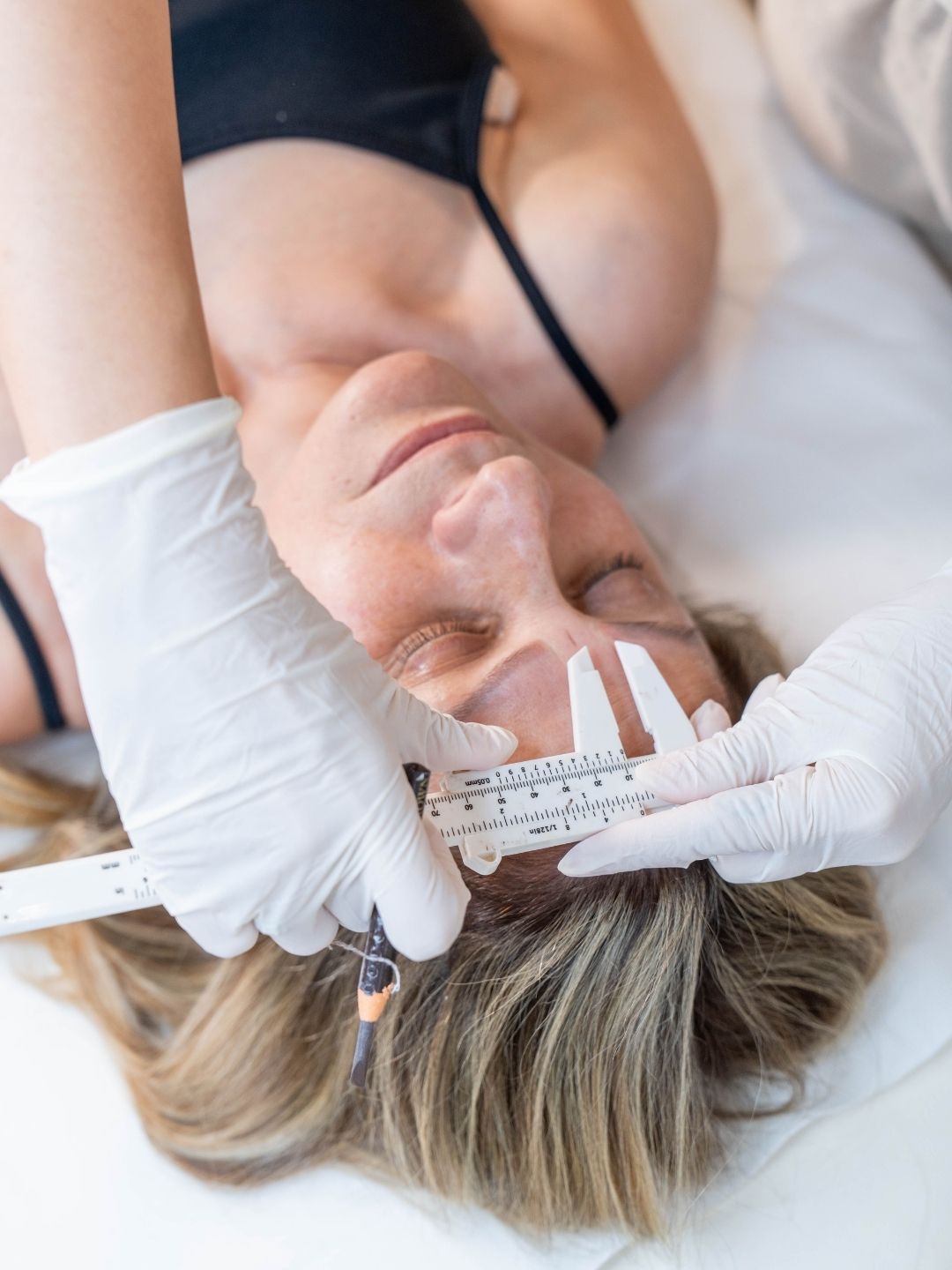 Brow mapping and measuring for powder brows procedure.