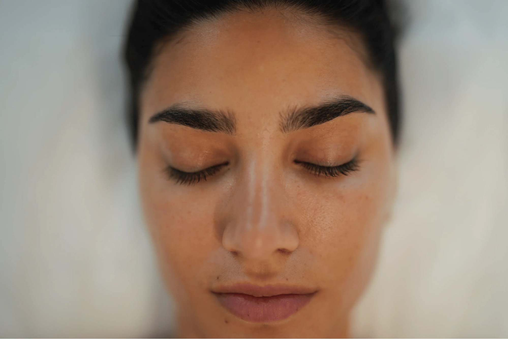 A woman after PRP treatment for face, showing improved under-eye skin tone, reduced dark circles, and smoother texture at BROWZ.