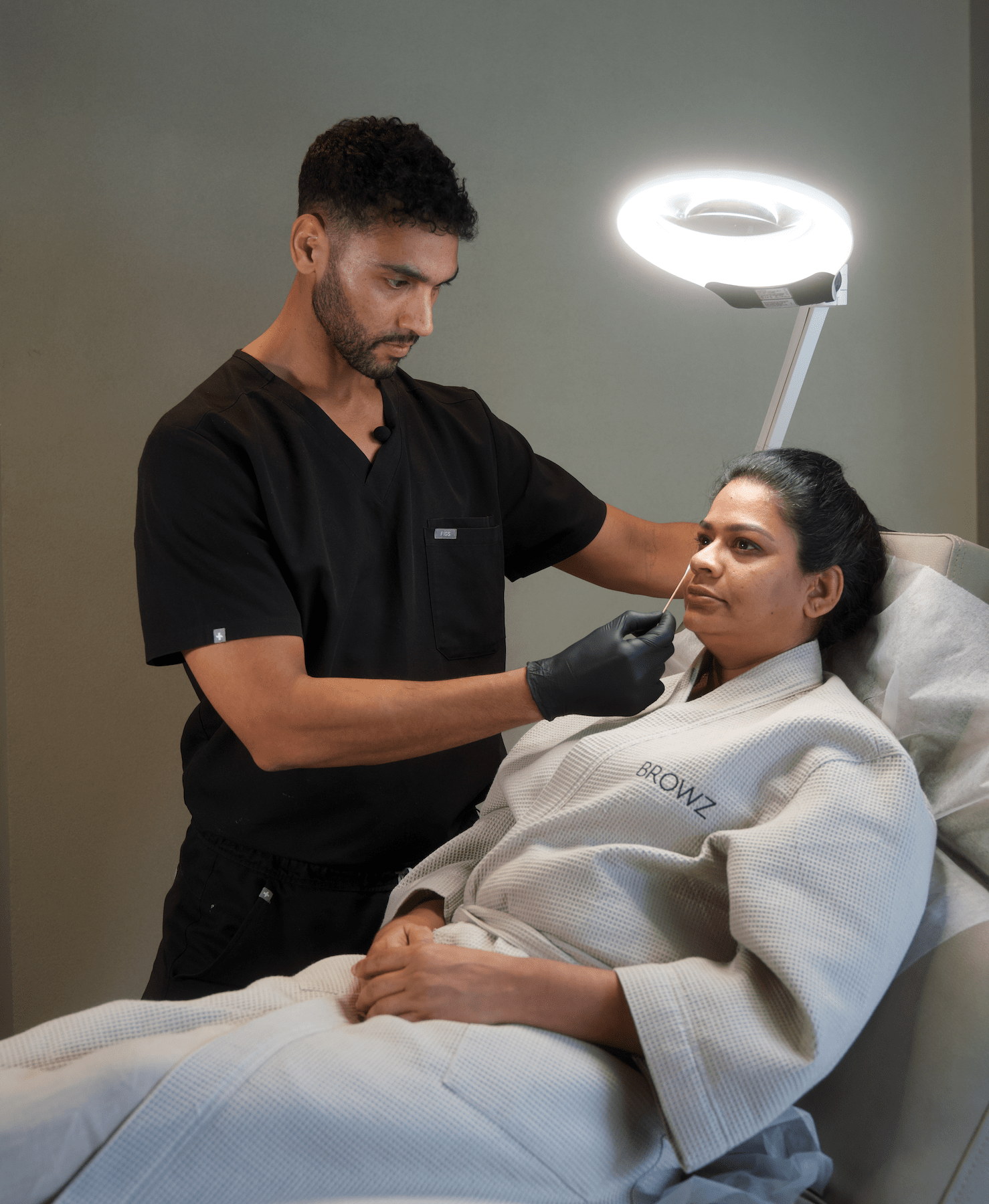 Client undergoing PRF under-eye treatment at BROWZ Dubai to reduce dark circles, improve skin texture, and restore a fresh look.