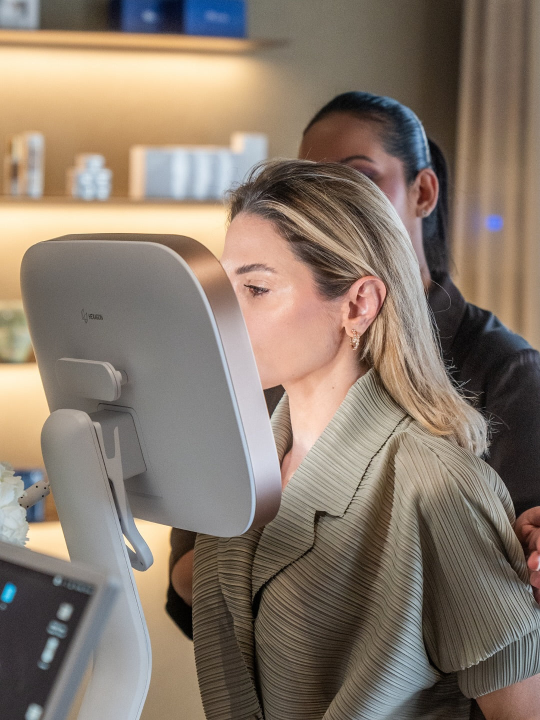 A female client on consultation using the Aura 3D Skin Analyser for bespoke Pico Laser treatment in Dubai at BROWZ clinic.