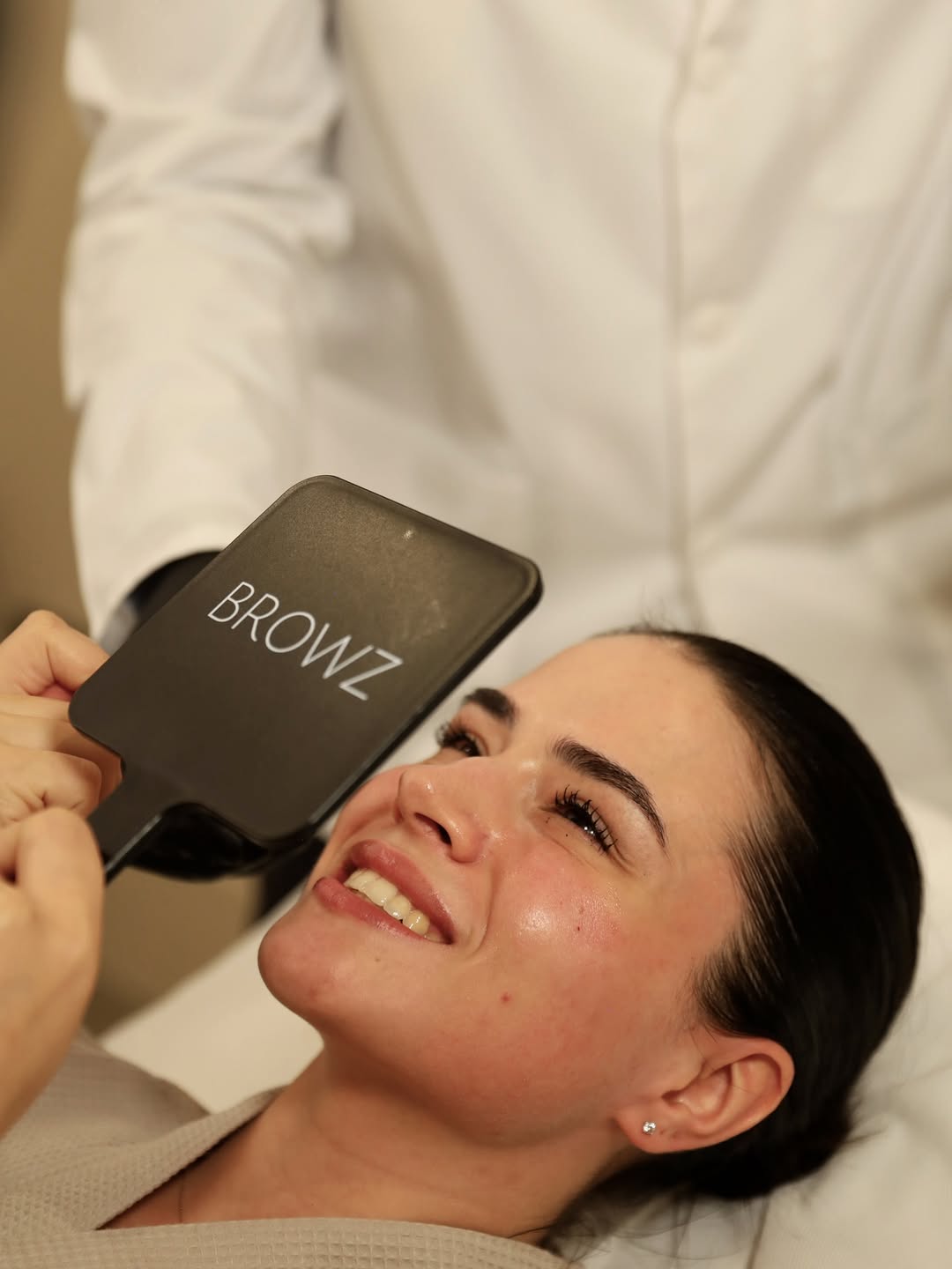 A woman on Sculptra Dubai treatment for radiant skin, representing the glow achieved after treatment by specialists at BROWZ.