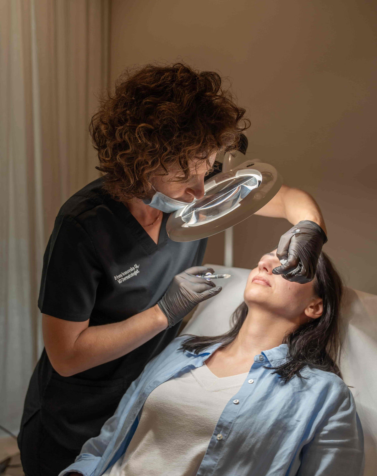 Woman undergoing Sculptra treatment in Dubai with specialist to restore facial volume and achieve smoother, youthful skin at BROWZ